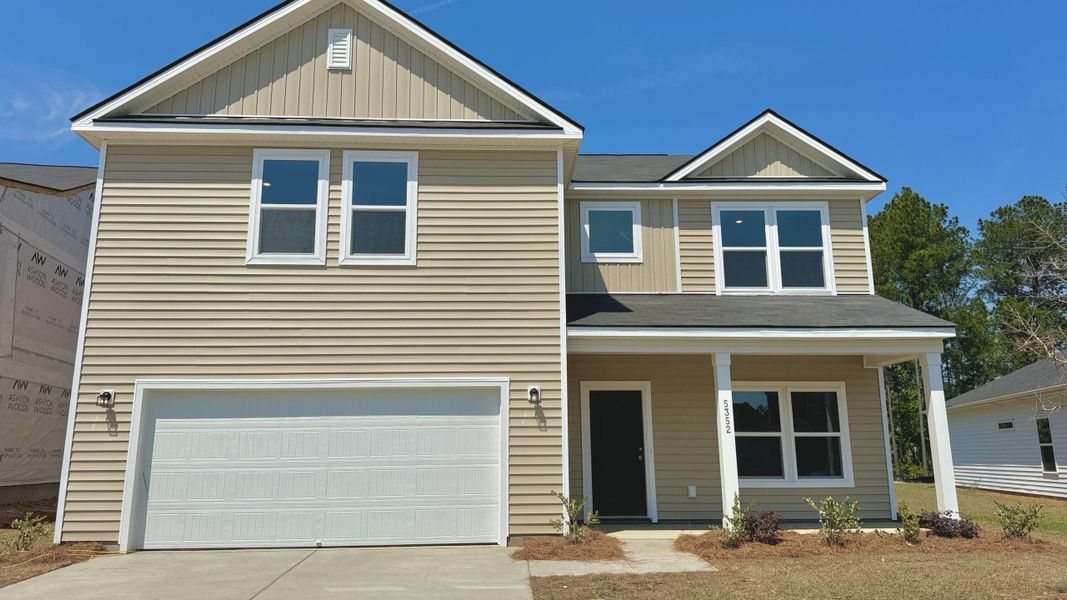 Front exterior of a new home in Watson Hill, Summerville, SC, highlighting curb appeal (Image 20).