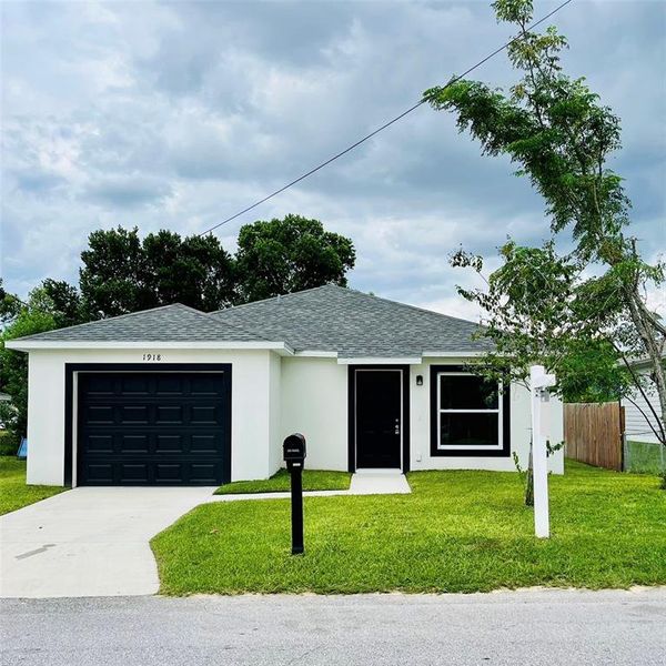 Front exterior of a new home in , Haines City, FL, highlighting curb appeal (Image 6). Front exterior of a new home in , Haines City, FL, highlighting curb appeal (Image 6).