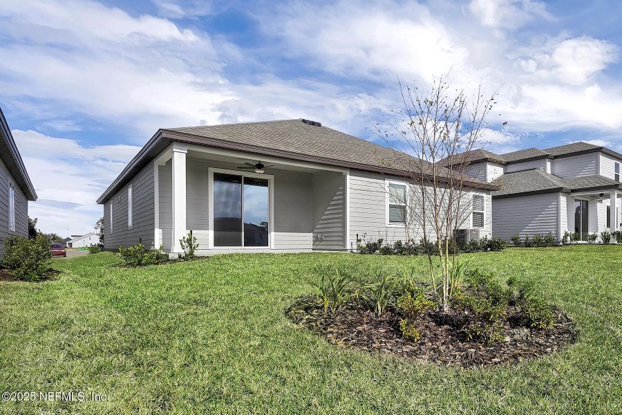 Front exterior of a new home in Jennings Farm, Middleburg, FL, highlighting curb appeal (Image 1). Front exterior of a new home in Jennings Farm, Middleburg, FL, highlighting curb appeal (Image 1).