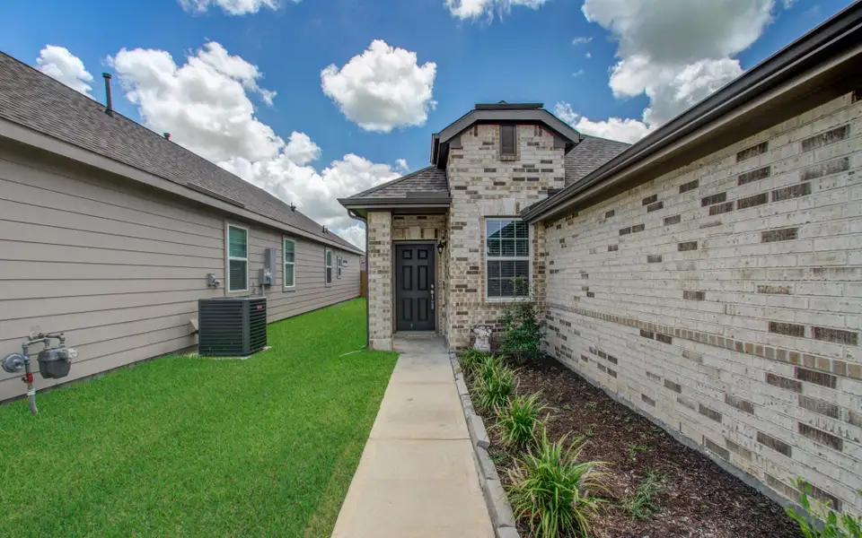 Charming single-story home with a brick facade and a spacious two-car garage. The property features a well-maintained front yard with lush green grass. Charming single-story home with a brick facade and a spacious two-car garage. The property features a well-maintained front yard with lush green grass.