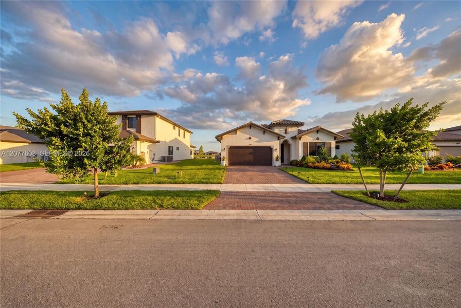 Front exterior of a new home in , Immokalee, FL, highlighting curb appeal (Image 33).
