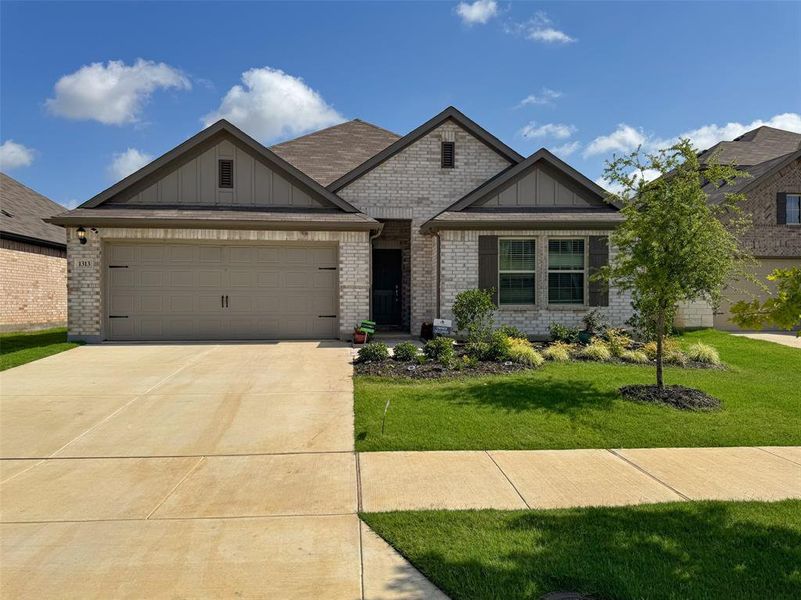 Front exterior of a new home in Woodmere, Denton, TX, highlighting curb appeal (Image 17). Front exterior of a new home in Woodmere, Denton, TX, highlighting curb appeal (Image 17).