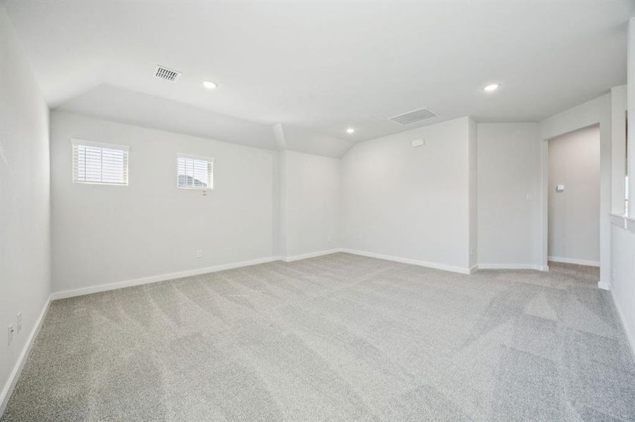 Game room in the Masters home plan by Trophy Signature Homes – REPRESENTATIVE PHOTO