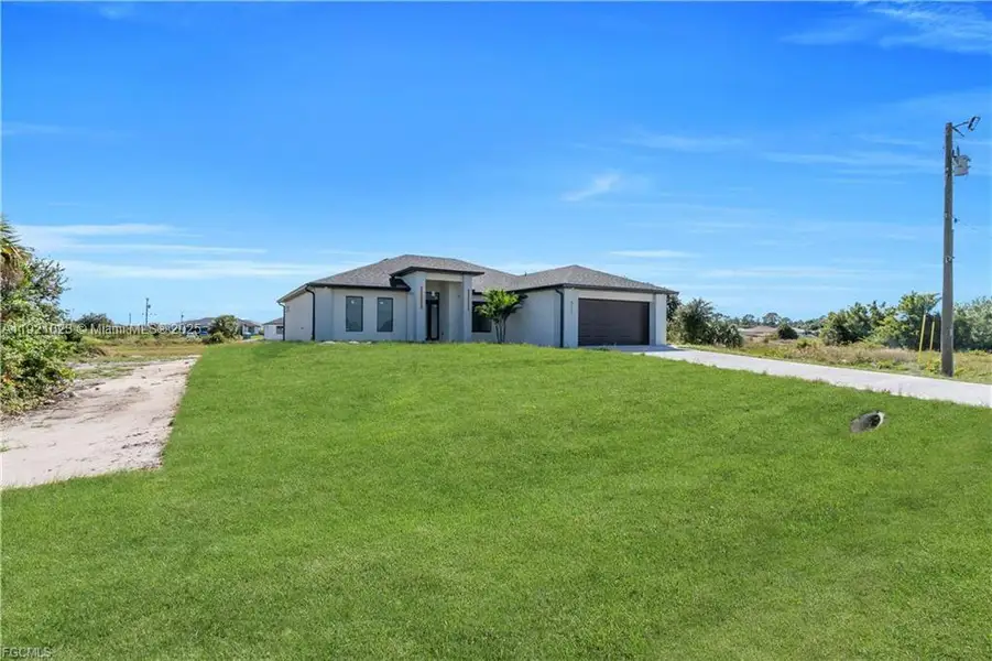 Exterior details and patio area of a home in , Lehigh Acres (Image 4). Exterior details and patio area of a home in , Lehigh Acres (Image 4).