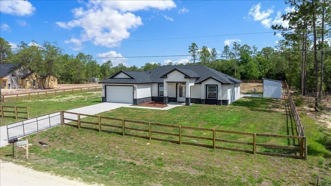 Front exterior of a new home in , Dunnellon, FL, highlighting curb appeal (Image 26). Front exterior of a new home in , Dunnellon, FL, highlighting curb appeal (Image 26).