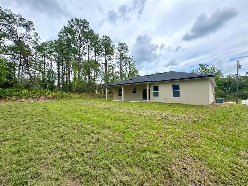 Exterior details and patio area of a home in , Citrus Springs (Image 20).