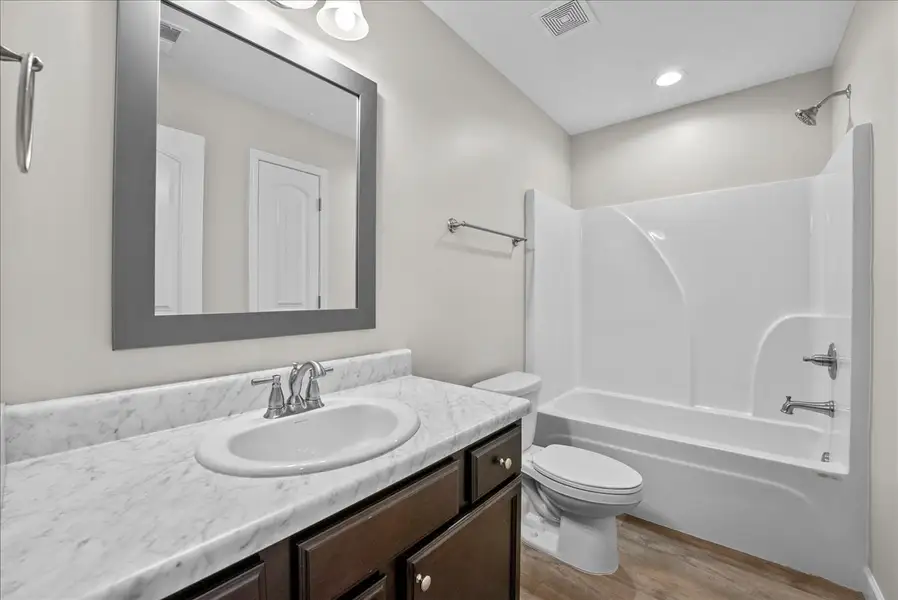Representative furnished interior of a home built from the Lyman by Enchanted Homes in Lonesome Dove, San Antonio (Image 12).