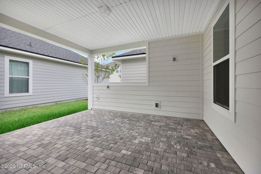 Exterior details and patio area of a home in Seabrook Village at Seabrook, Nocatee (Image 29).