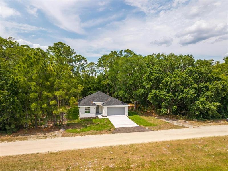 Front exterior of a new home in , Eustis, FL, highlighting curb appeal (Image 2).