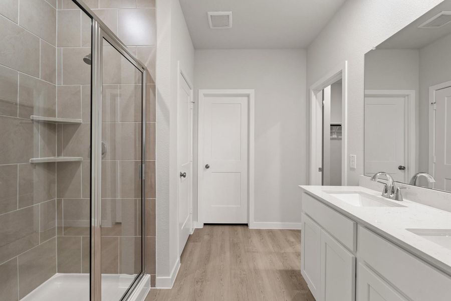 Furnished interior view inside a new home in Sunterra, Katy (Image 7).