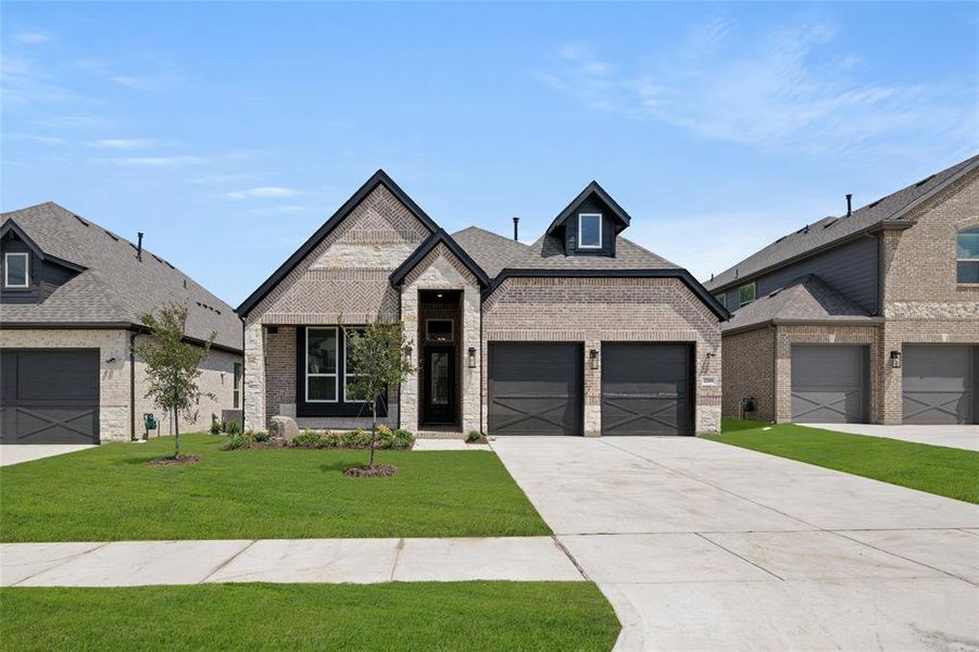 Front exterior of a new home in Birdsong, Mansfield, TX, highlighting curb appeal (Image 27). Front exterior of a new home in Birdsong, Mansfield, TX, highlighting curb appeal (Image 27).