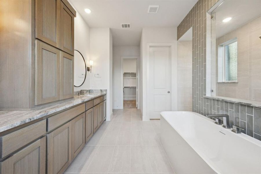Beautiful cabinetry, gorgeous counter tops and plenty of room for two, this dream owner's bath is waiting for you to make it your own!