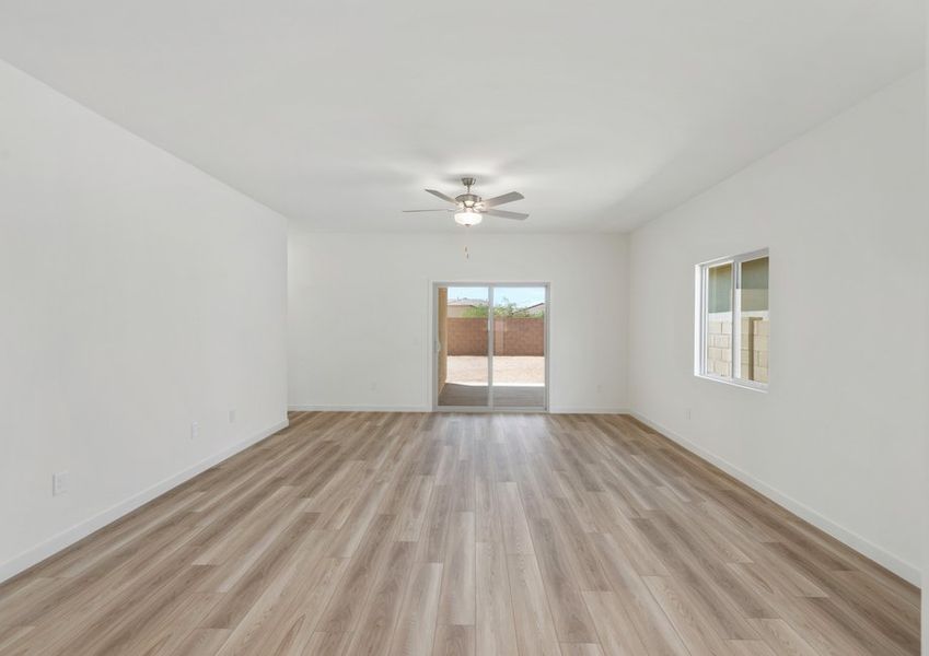 Through the living area, sliding glass doors lead you to your own private backyard.