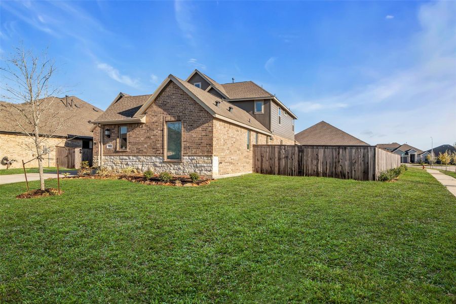 Front exterior of a new home in , Baytown, TX, highlighting curb appeal (Image 1).