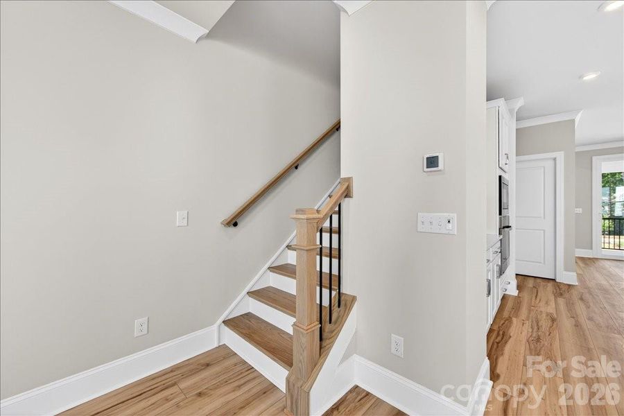 Oak box stairs with open rails on second floor