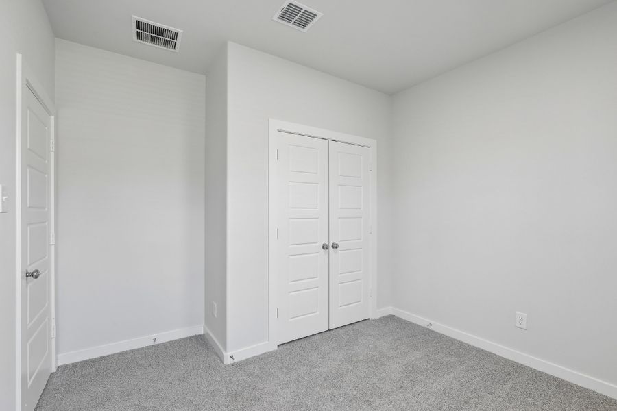 Bedroom in the Holden home plan by Trophy Signature Homes