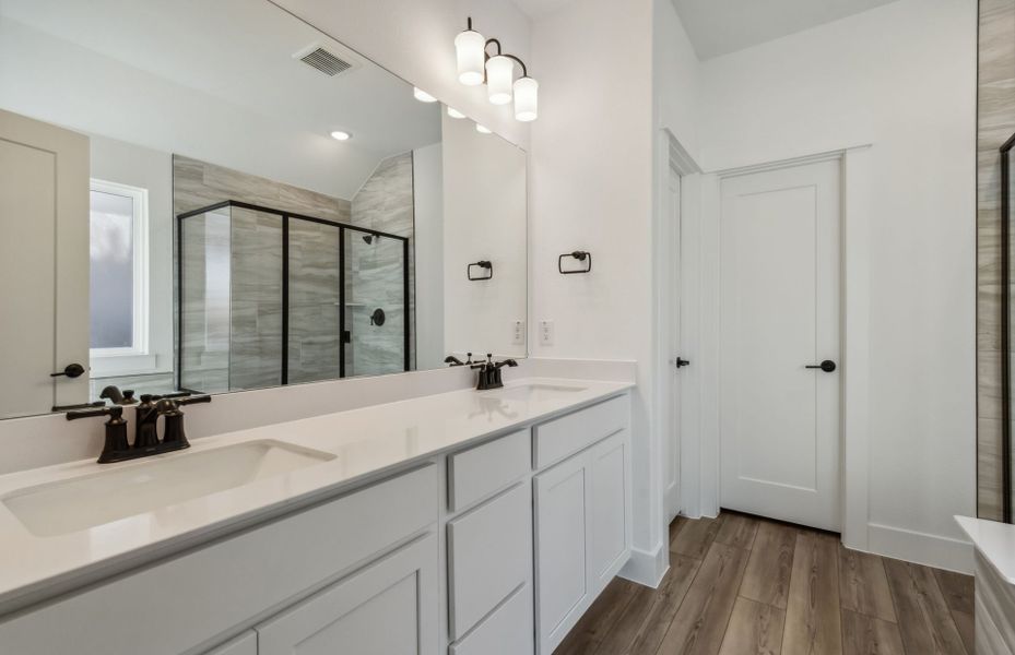 Owner's bathroom with dual vanity *real home pictured