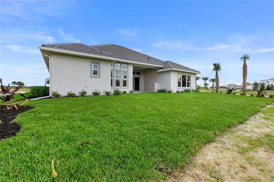 Front exterior of a new home in Veranda Bay, Flagler Beach, FL, highlighting curb appeal (Image 30). Front exterior of a new home in Veranda Bay, Flagler Beach, FL, highlighting curb appeal (Image 30).