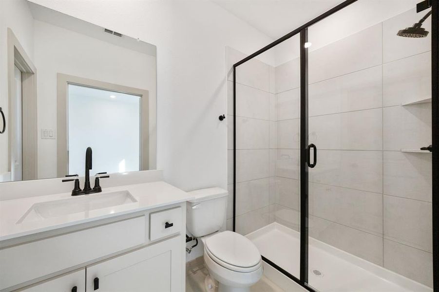 Guests will feel right at home in either of the beautifully finished guest baths.