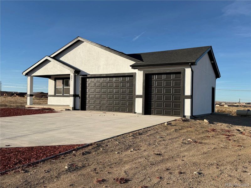 Front exterior of a new home in , Pueblo, CO, highlighting curb appeal (Image 2). Front exterior of a new home in , Pueblo, CO, highlighting curb appeal (Image 2).