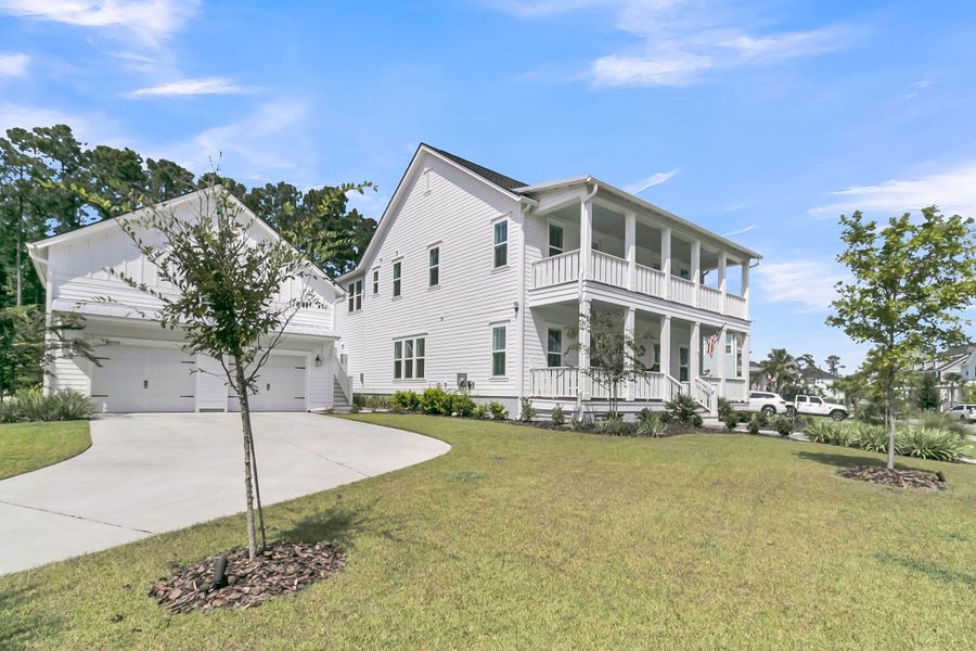 Front exterior of a new home in Carolina Park: Riverside, Mount Pleasant, SC, highlighting curb appeal (Image 19). Front exterior of a new home in Carolina Park: Riverside, Mount Pleasant, SC, highlighting curb appeal (Image 19).