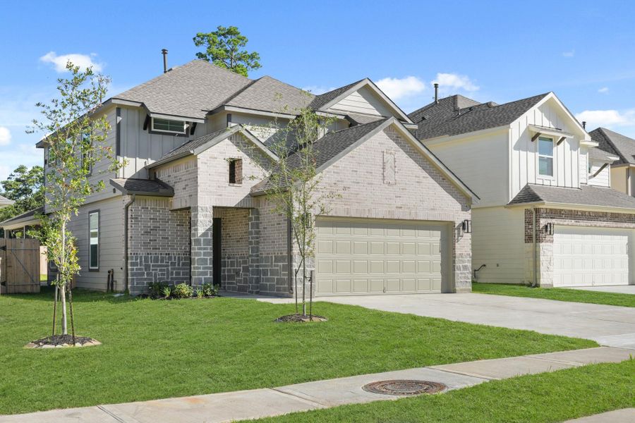 Front exterior of a new home in Cypresswood Landing, Humble, TX, highlighting curb appeal (Image 14).