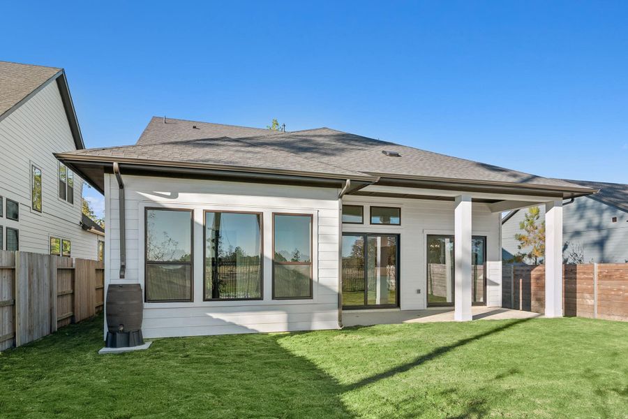 Exterior details and patio area of a home in ARTAVIA 50' Homesites, Conroe (Image 27).