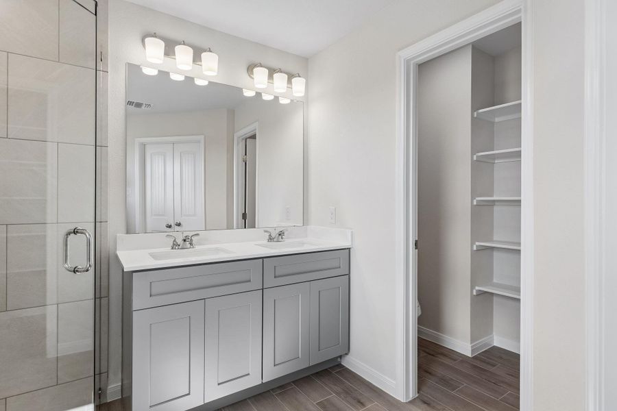 Secondary bath with adjoining storage.