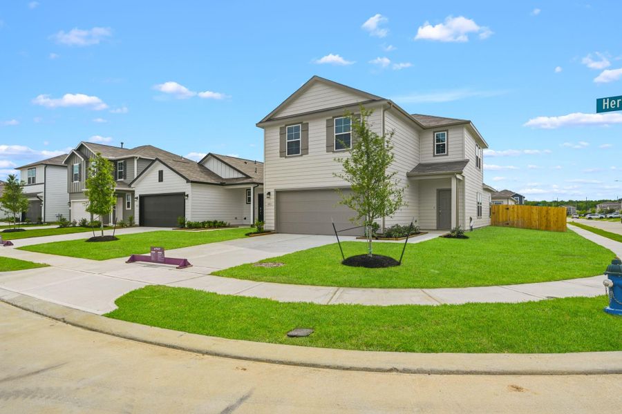 Front exterior of a new home in Barrett Crossing, Crosby, TX, highlighting curb appeal (Image 1). Front exterior of a new home in Barrett Crossing, Crosby, TX, highlighting curb appeal (Image 1).