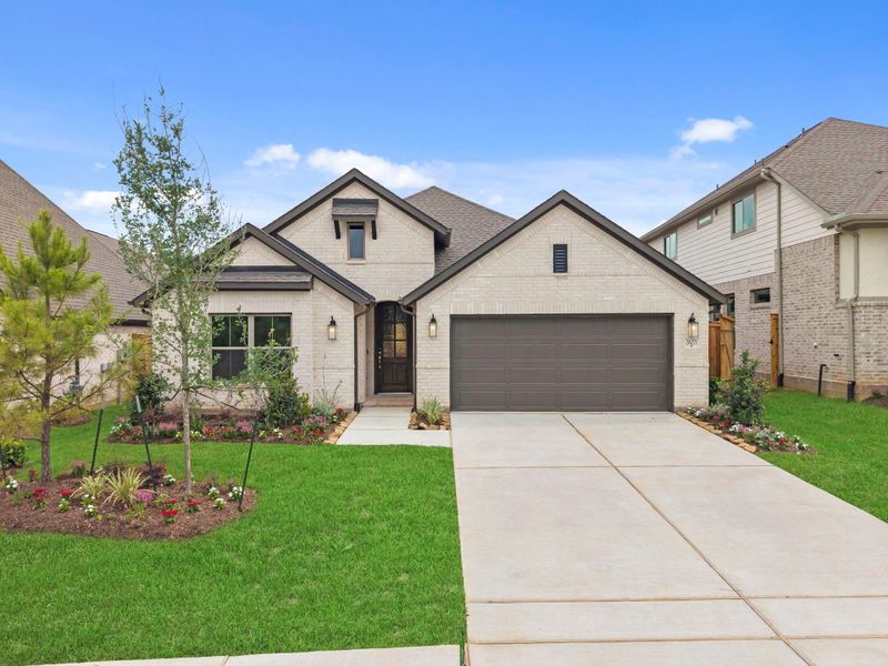 Front exterior of a new home in Wildtree, Magnolia, TX, highlighting curb appeal (Image 21).