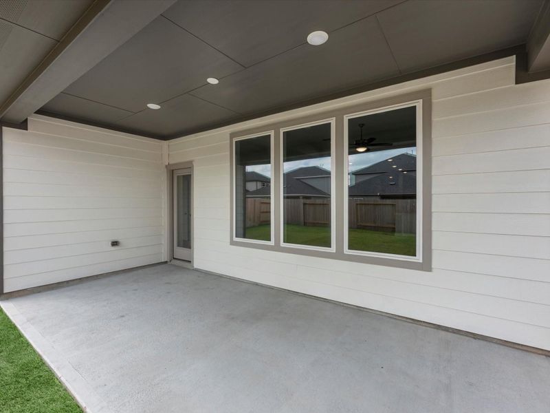 Exterior details and patio area of a home in Mason Woods, Cypress (Image 4).