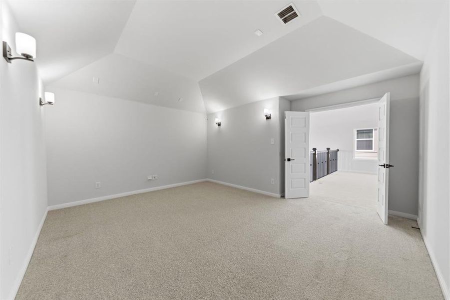 This spacious media room with adjacent game room create the ultimate entertainment zone in your new dream home!