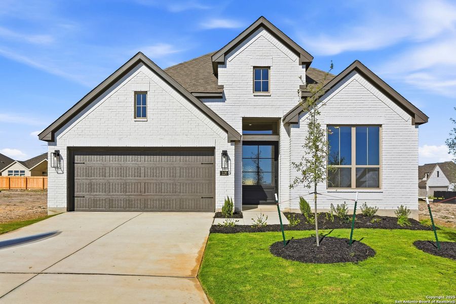 Front exterior of a new home in Haby Hill 50s, San Antonio, TX, highlighting curb appeal (Image 2). Front exterior of a new home in Haby Hill 50s, San Antonio, TX, highlighting curb appeal (Image 2).