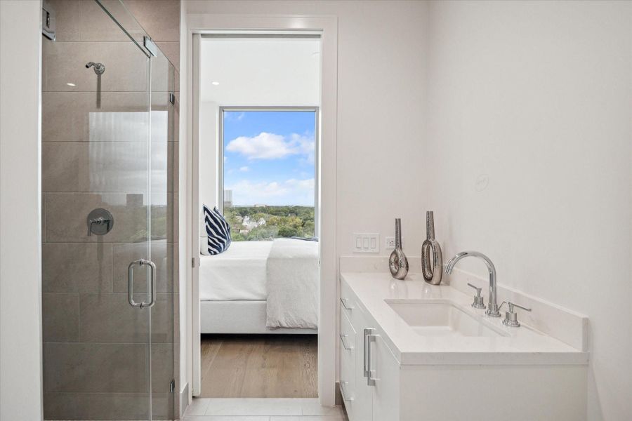 En-suite bathroom. Photos are of a similar unit with the same floor plan