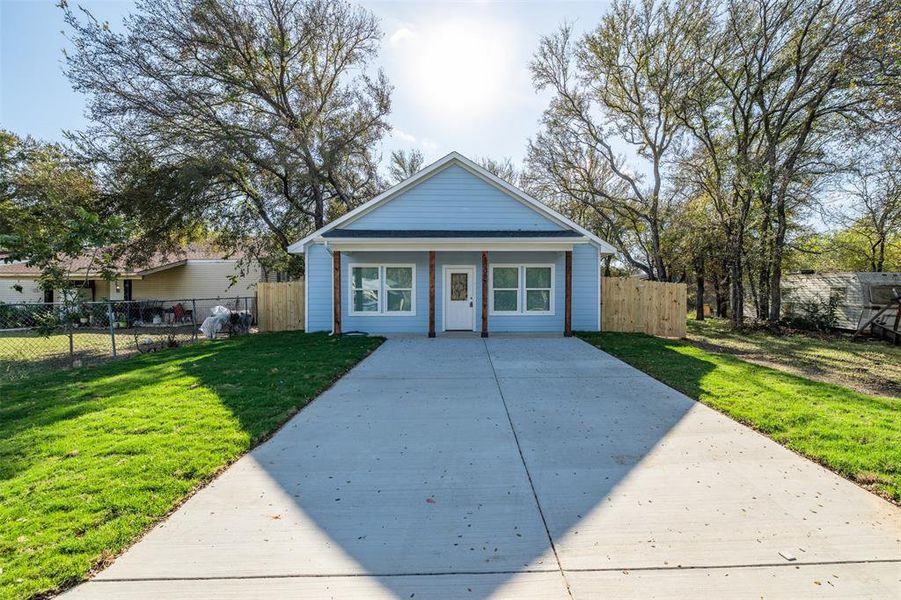 Bungalow-style house featuring a front yard and a porch