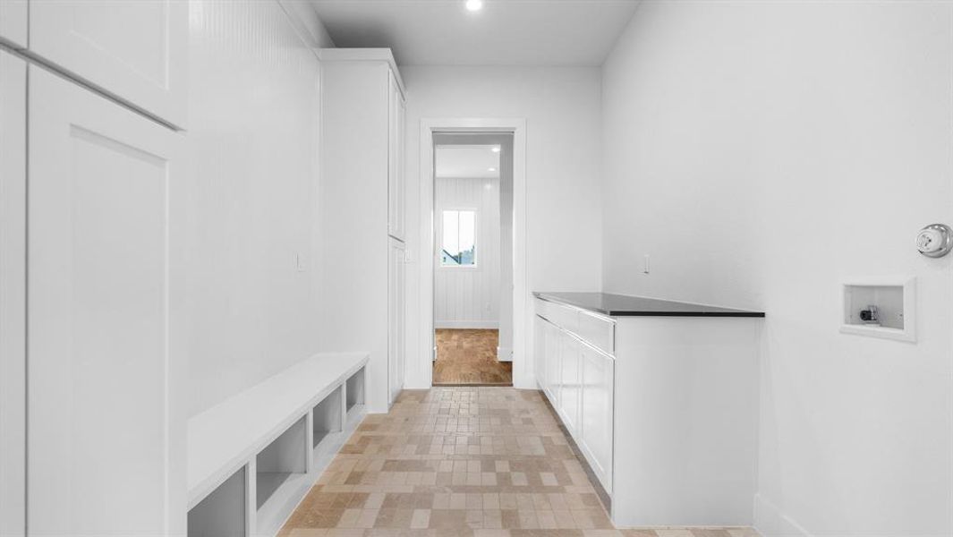 Mudroom featuring light tile patterned floors