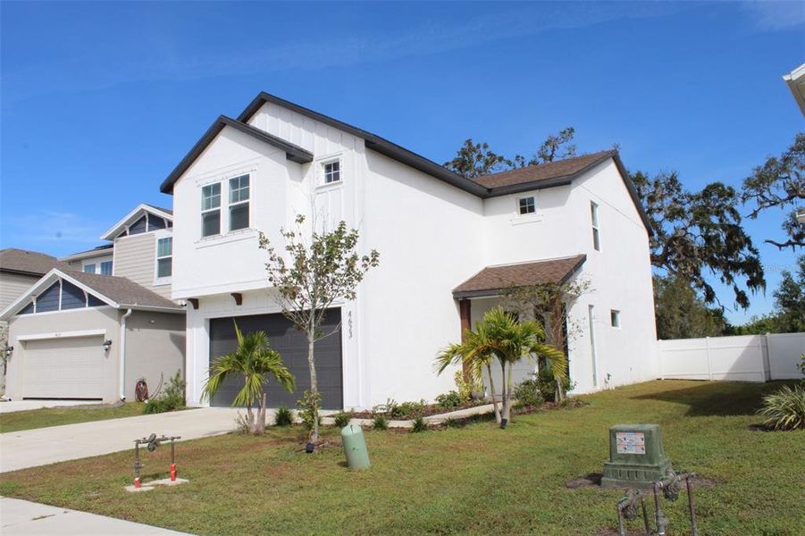 Front exterior of a new home in , Palmetto, FL, highlighting curb appeal (Image 20).