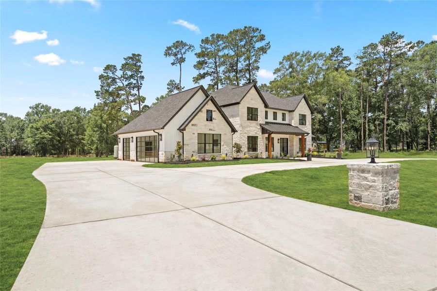 Modern 3-car garage with clear glass doors (22’ x 34’-2’+) Modern 3-car garage with clear glass doors (22’ x 34’-2’+)