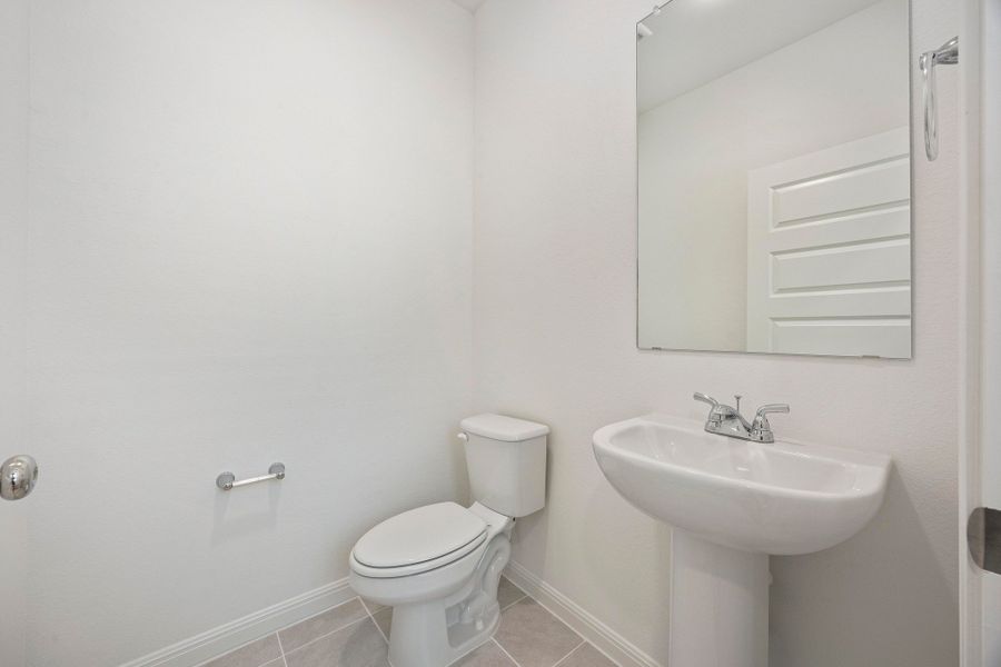 Half Bath in the Magnolia home plan by Trophy Signature Homes – REPRESENTATIVE PHOTO
