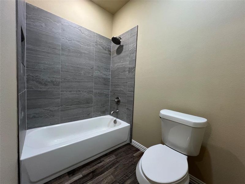 Full bathroom with separate Tile Surround Tub-Shower and Toilet room