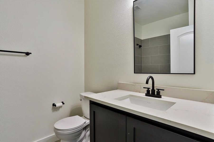 Bathroom with vanity and toilet