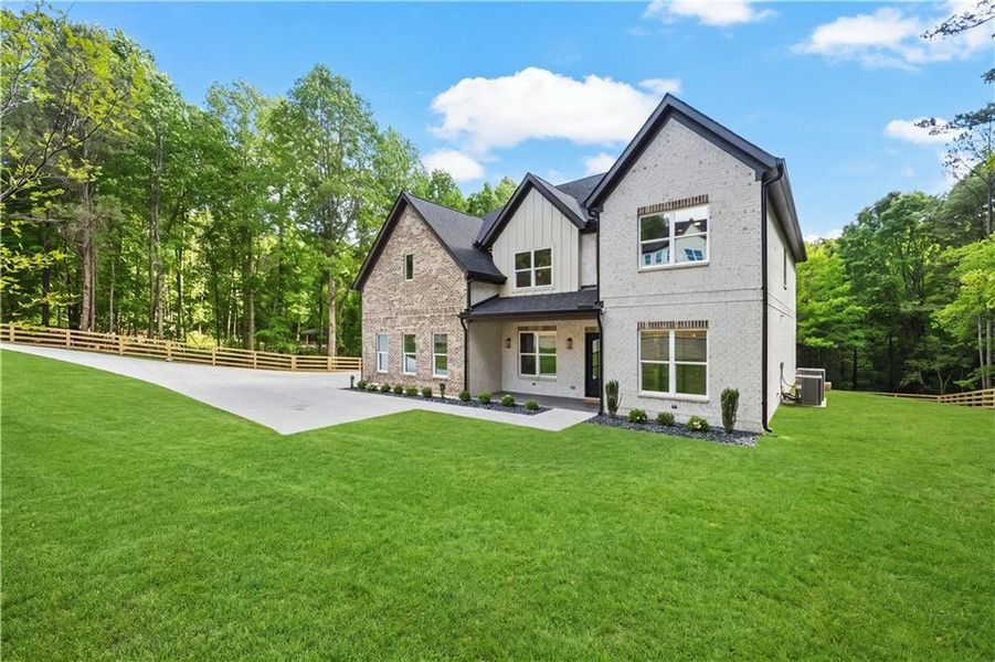 Front exterior of a new home in , Dacula, GA, highlighting curb appeal (Image 30).