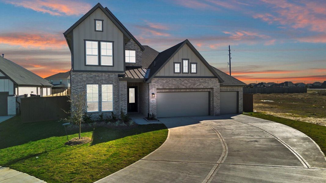 Front exterior of a new home in Blue Heron, Mont Belvieu, TX, highlighting curb appeal (Image 22).