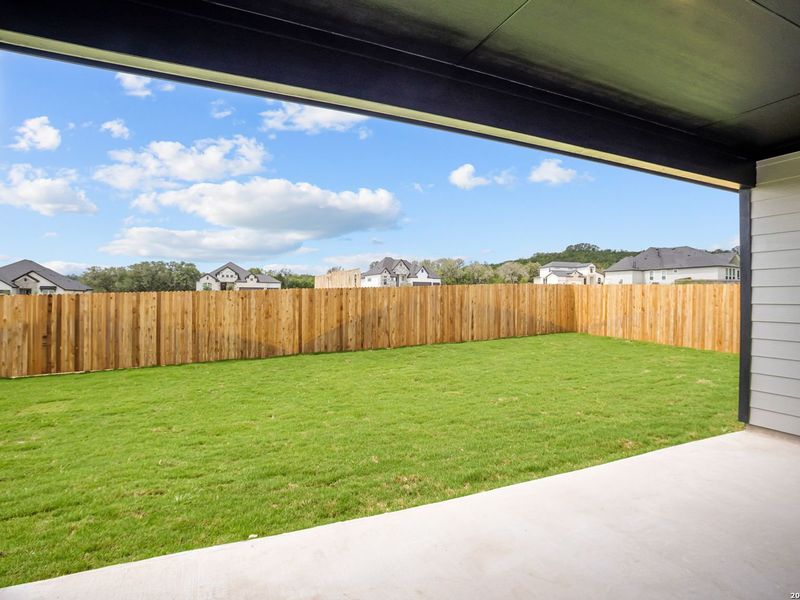 Exterior details and patio area of a home in The Reserve at Potranco Oaks, Castroville (Image 3).