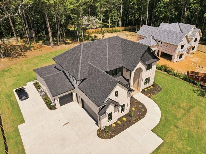 Front exterior of a new home in , Loganville, GA, highlighting curb appeal (Image 26).