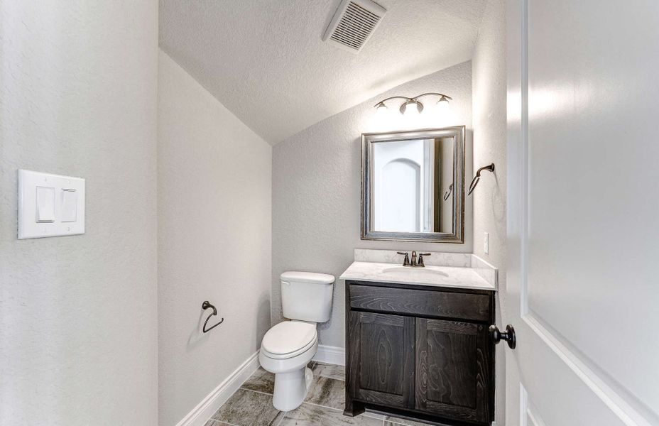 Representative furnished interior of a home built from the 3799 by Ravenna Homes in Artavia 70′, Conroe (Image 11).