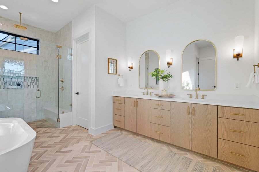 Bathroom featuring a stall shower, a soaking tub, double vanity, and recessed lighting Bathroom featuring a stall shower, a soaking tub, double vanity, and recessed lighting