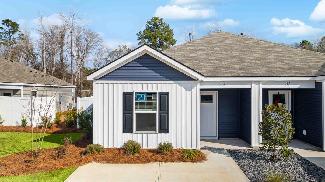 Front exterior of a new home in The Timbers, Harleyville, SC, highlighting curb appeal (Image 2). Front exterior of a new home in The Timbers, Harleyville, SC, highlighting curb appeal (Image 2).