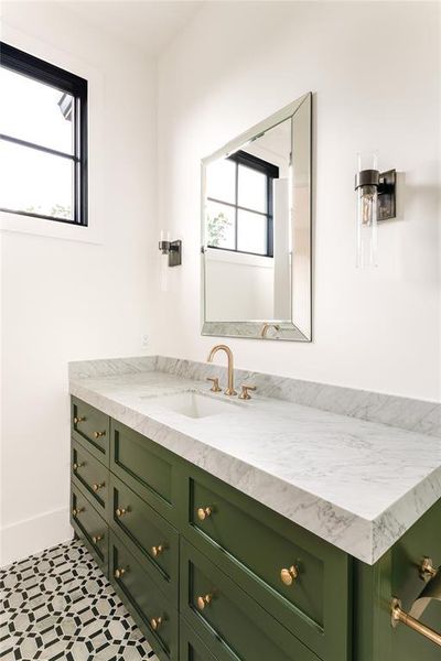 Bathroom featuring vanity and baseboards
