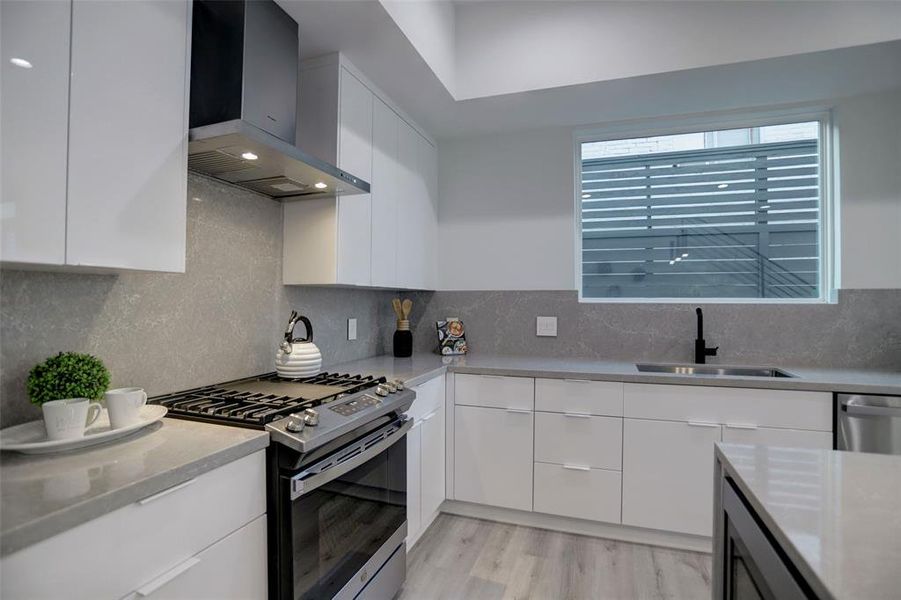 Polished, modern kitchen with high-end appliances and sophisticated finishes.